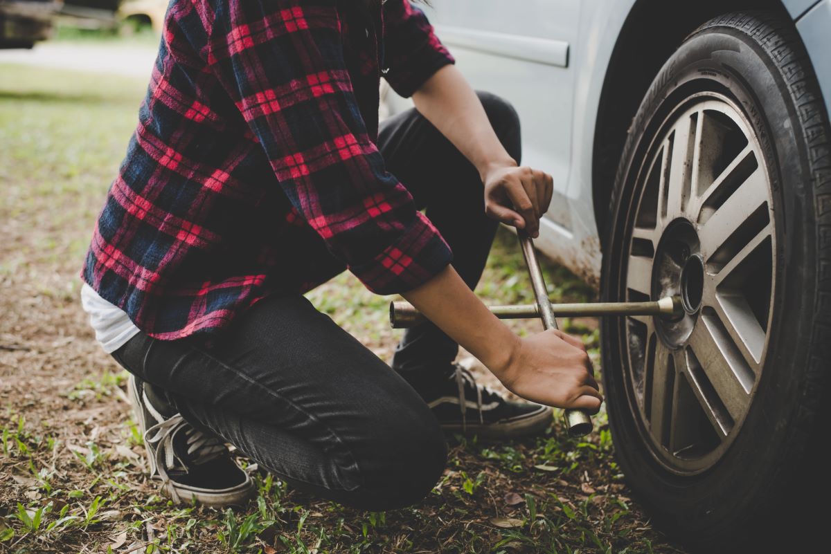 Person changing a tire
