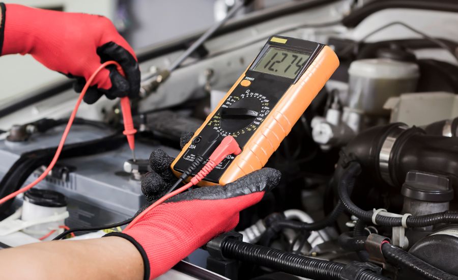 Service technician testing a battery